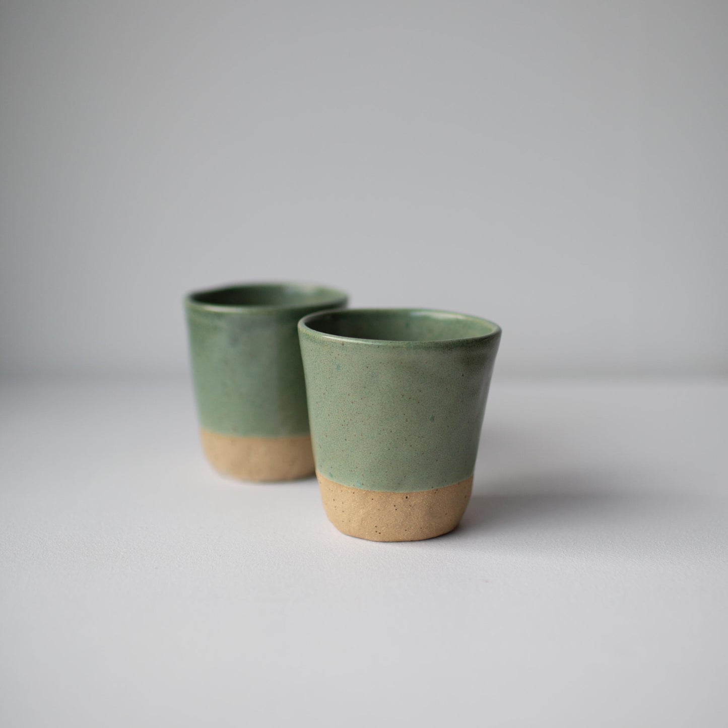 Coffee tumblers - Sage green on speckled clay